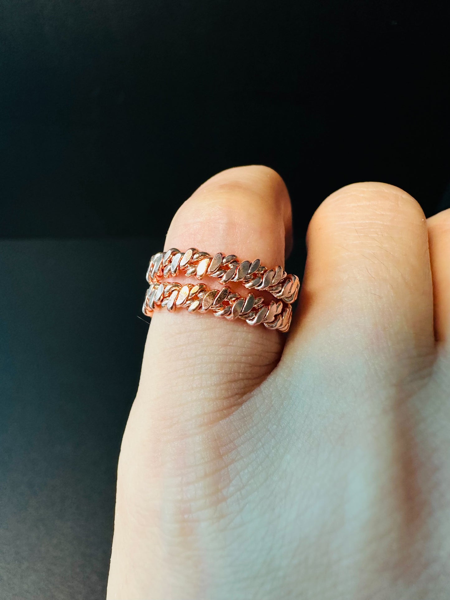 Twisted copper ring worn on a finger, a quiet everyday piece for meditation and grounding