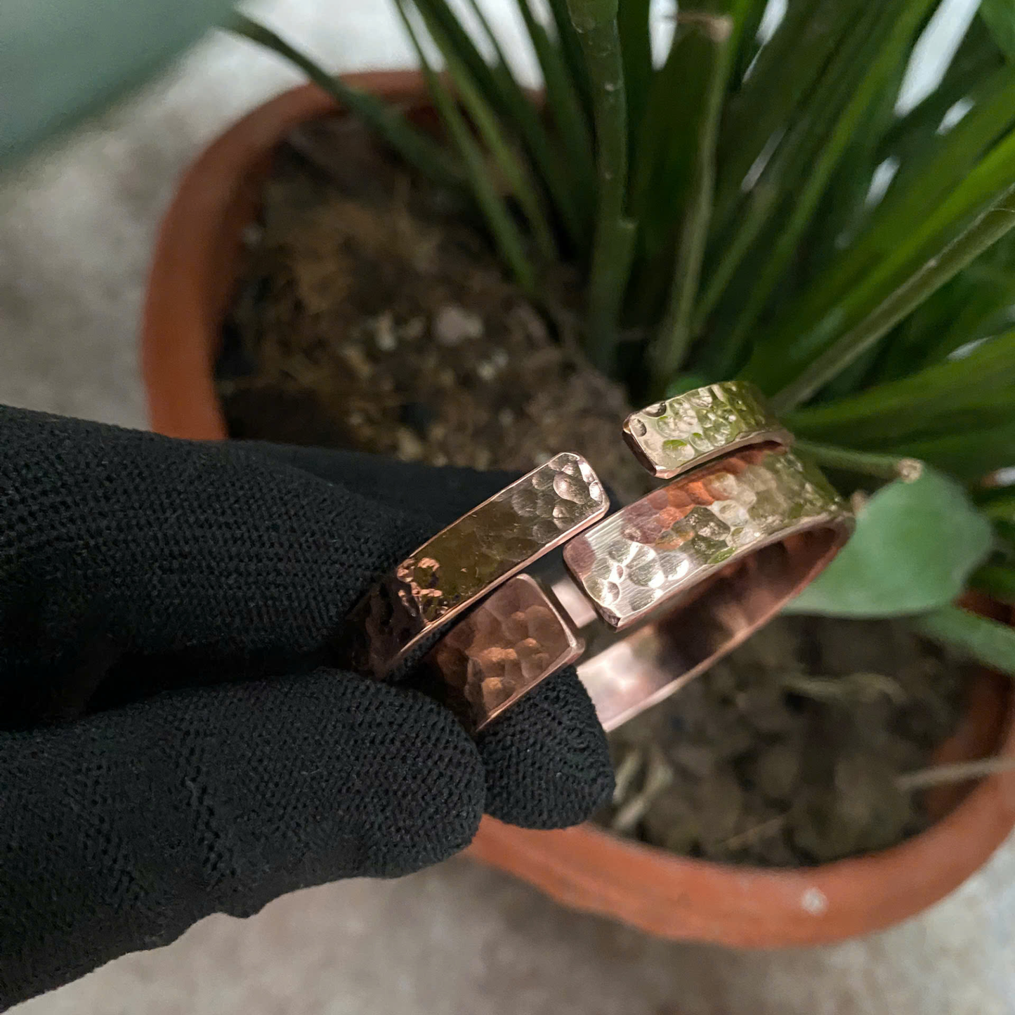 Handmade pure copper hammered cuff bracelet held in hand, 7th copper anniversary gift