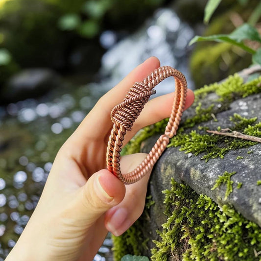 Double spiral copper cuff bracelet, hand-twisted pure red copper – TensorPrana, front view