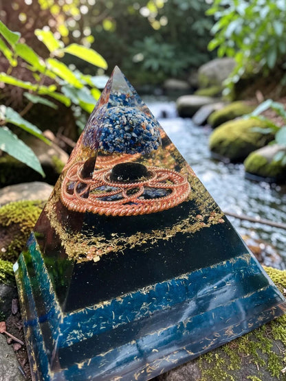 Abusta Viking Tensor Copper Necklace, a sacred geometry energy tool pyramid with blue layers, copper coil, and blue crystal chips.