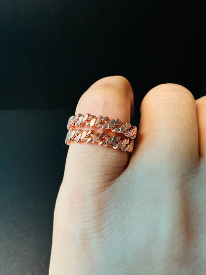 Twisted copper ring worn on a finger, a quiet everyday piece for meditation and grounding