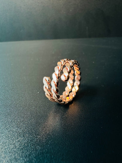 Side view of the chunky copper chain ring showing its thick linked band and polished faces