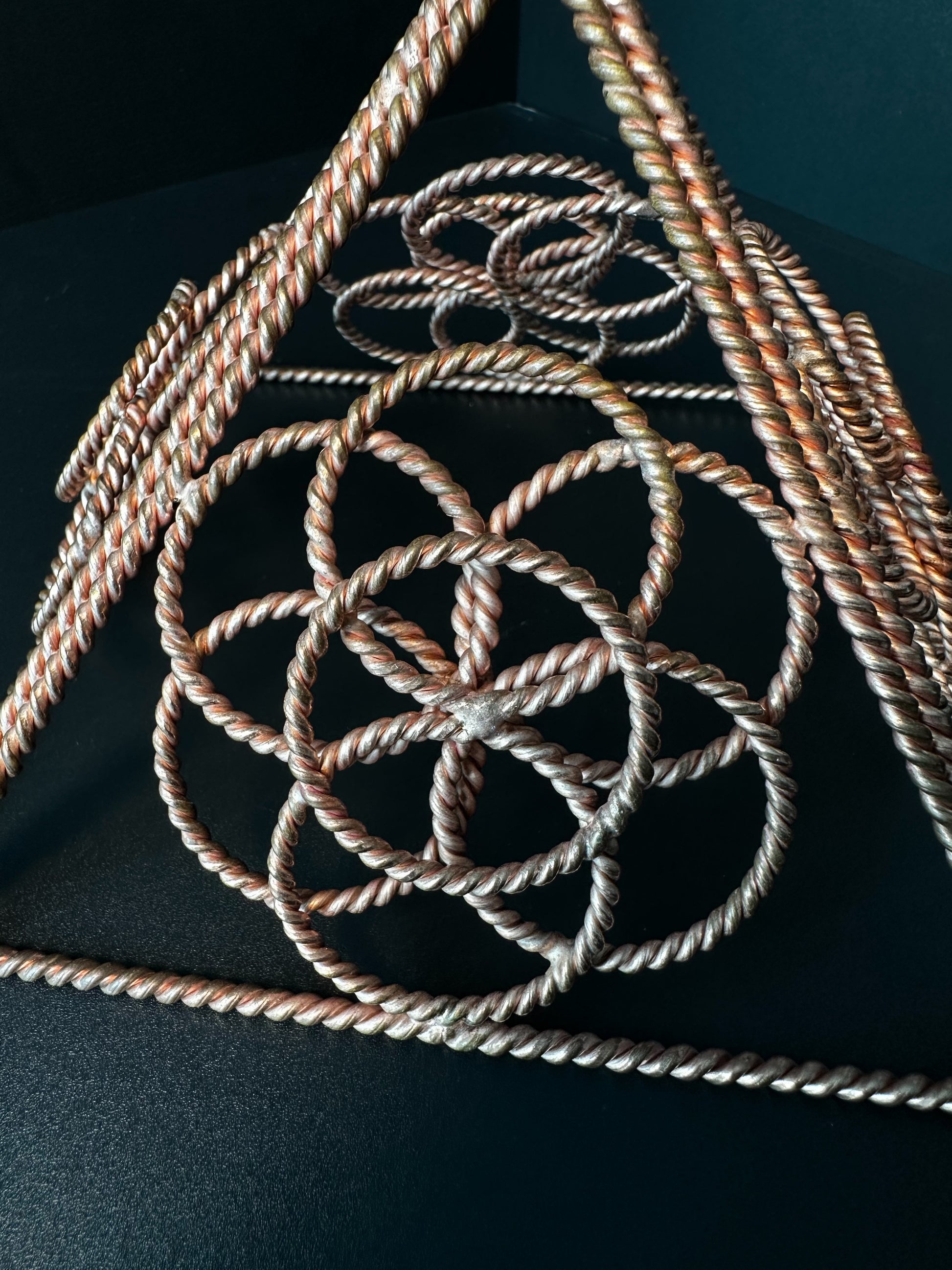 Close-up of twisted copper Flower of Life inside the merkaba
