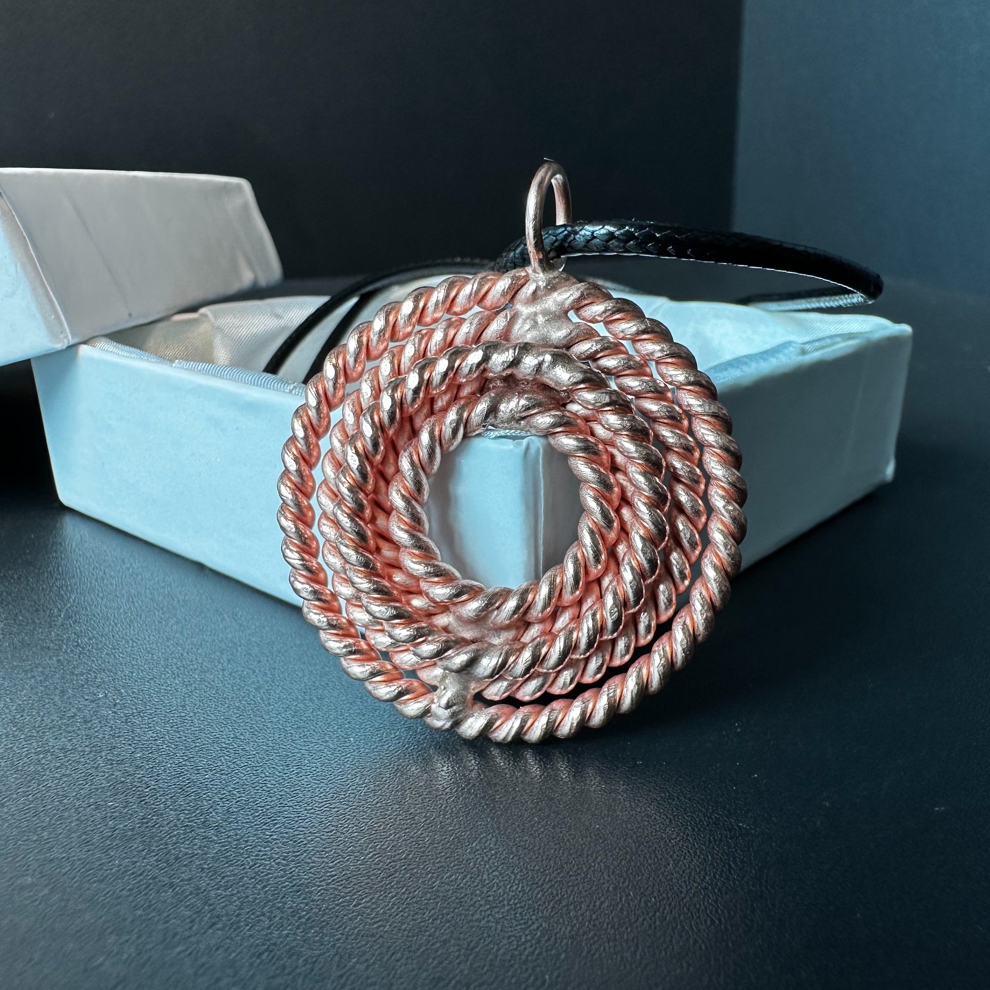 Handmade copper sacred geometry pendant with a woven spiral face, five-frequency tensor necklace on a cord