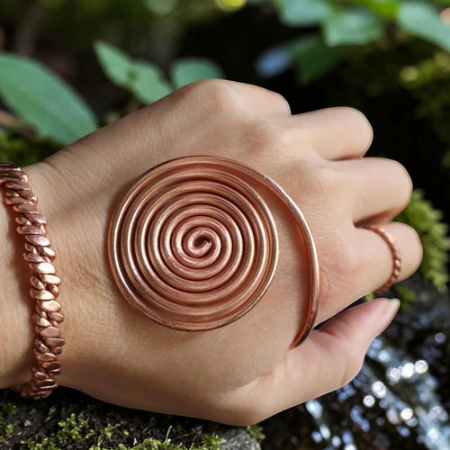 Copper spiral vortex disc hand-wound from twisted pure red copper wire, flat coil viewed from above