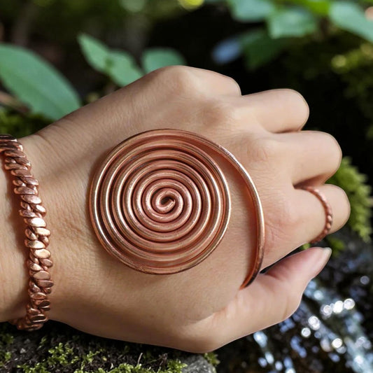 Copper spiral vortex disc hand-wound from twisted pure red copper wire, flat coil viewed from above