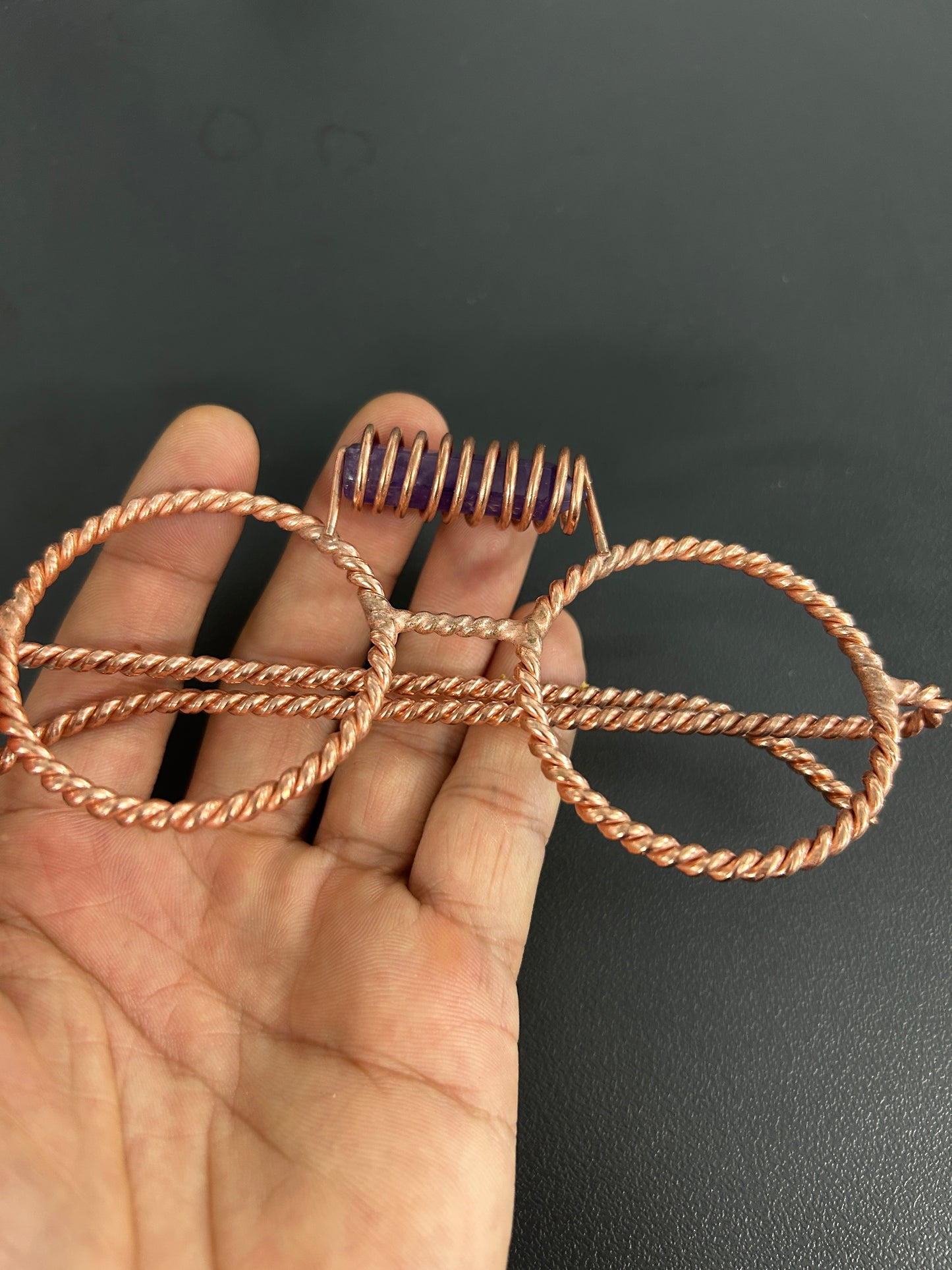 Close up amethyst crystal coil detail on copper tensor glasses