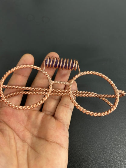 Close up amethyst crystal coil detail on copper tensor glasses
