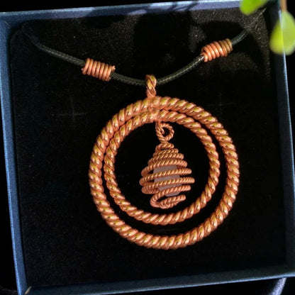 Copper tensor coil pendant with a quartz center, 144, 177 and 188MHz, handmade sacred geometry necklace