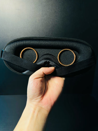 Front of a black 3D contoured sleep mask displayed upright, soft padded fabric with a contoured nose bridge