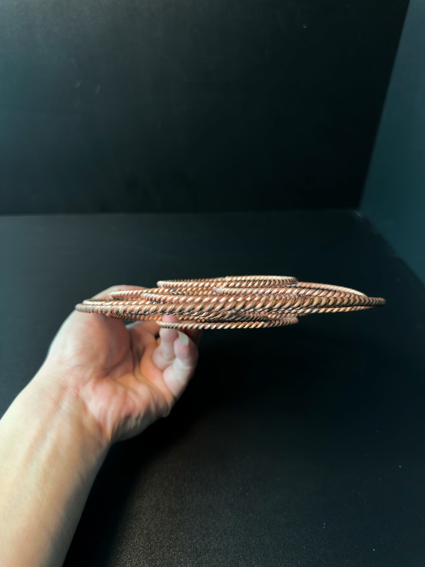 Side profile of the copper torus, showing how the woven rings layer into a sphere