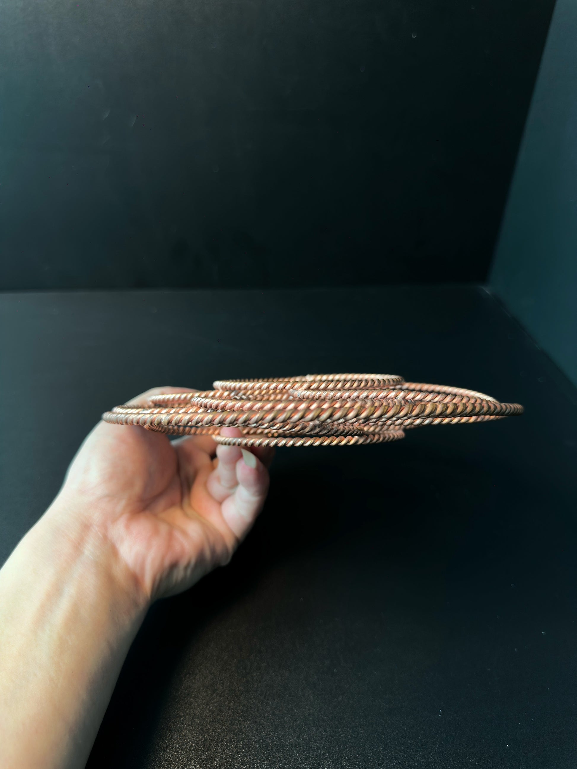 Side profile of the copper torus, showing how the woven rings layer into a sphere