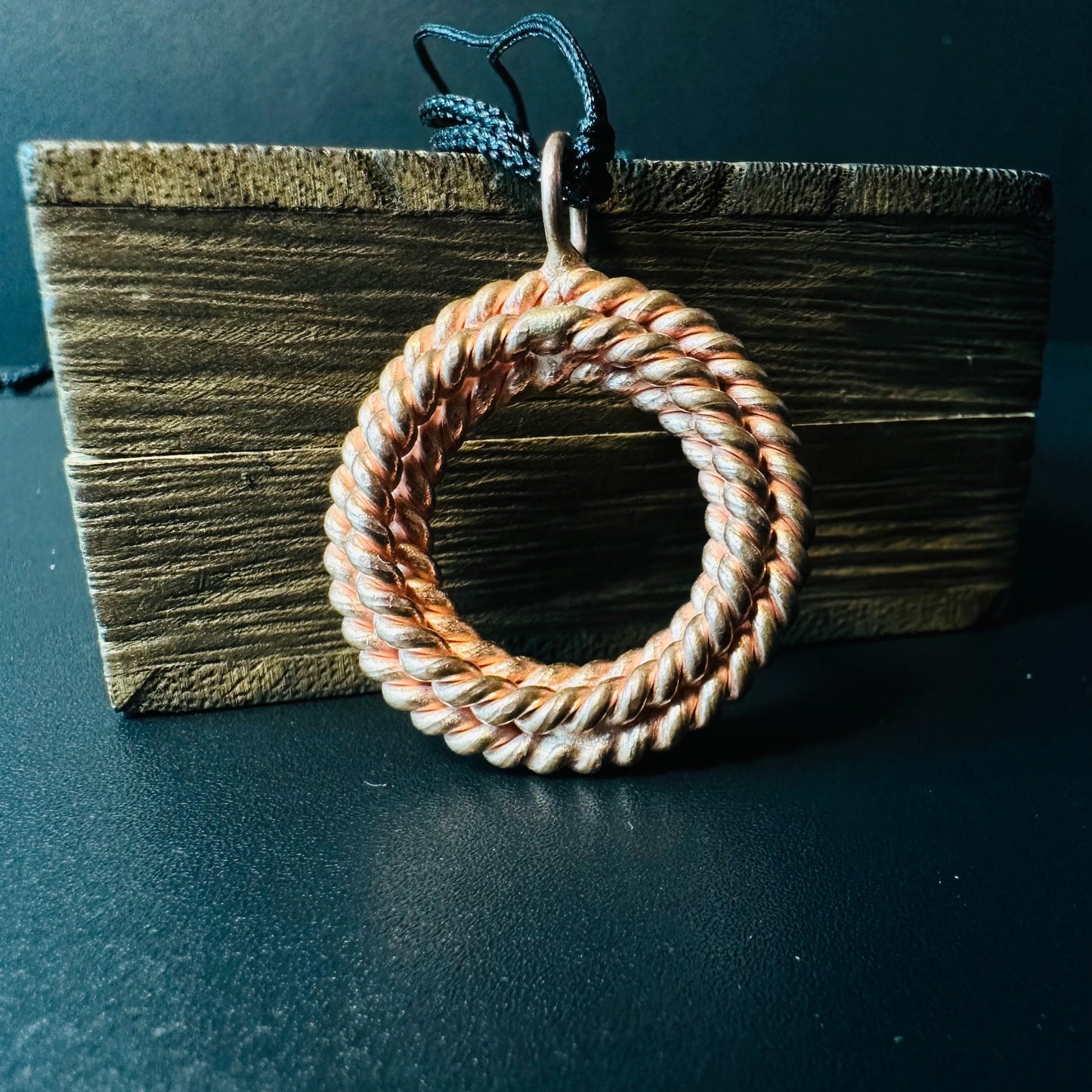 Handmade copper twisted ring pendant, a single rope-twisted circle