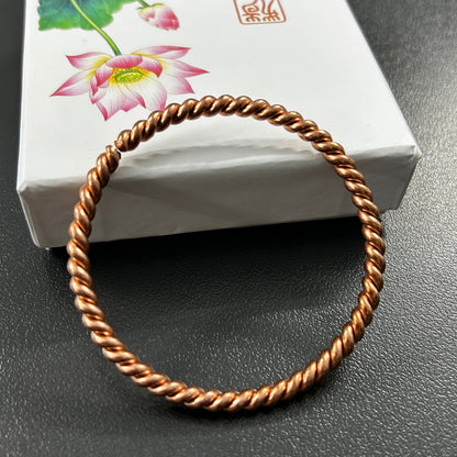Handmade pure copper twisted rope bangle, open adjustable cuff bracelet, solid copper spiral bangle front view.