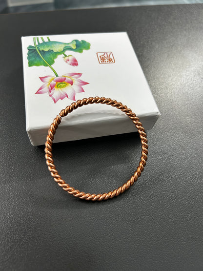 Copper twisted rope bangle worn on wrist, unisex handmade adjustable copper bracelet for men and women.
