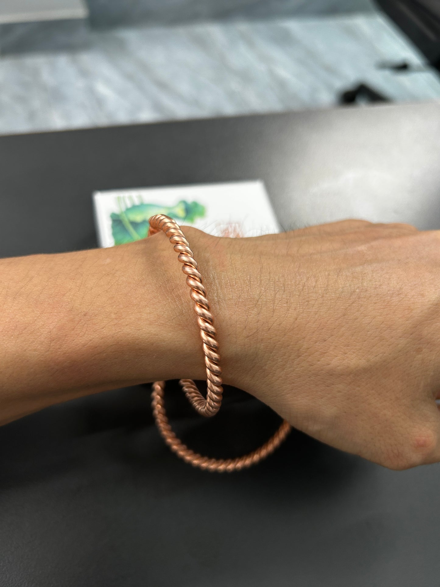 Close-up of twisted rope texture on handmade pure copper bangle, matching couples and best friend copper bracelet detail.