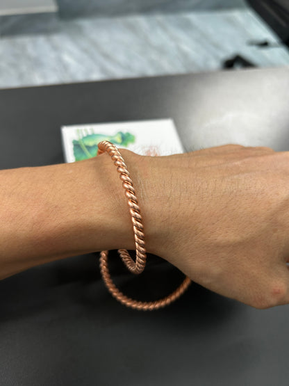 Close-up of twisted rope texture on handmade pure copper bangle, matching couples and best friend copper bracelet detail.