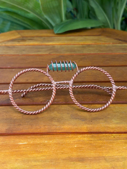 Close up green aventurine crystal coil detail on copper tensor glasses