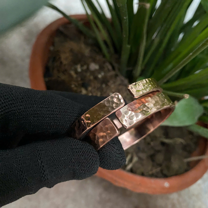 Handmade pure copper hammered cuff bracelet held in hand, 7th copper anniversary gift