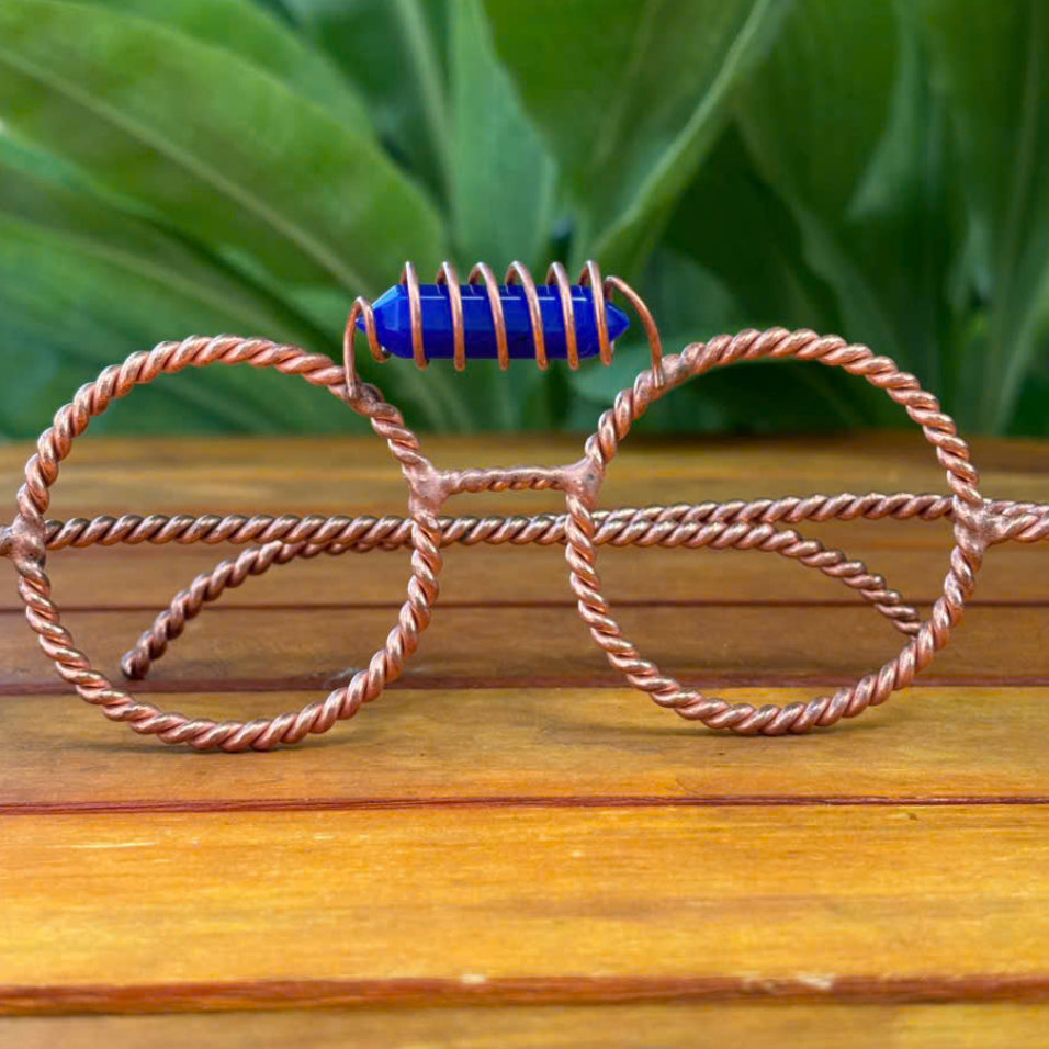 Close up lapis lazuli crystal coil detail on copper tensor glasses
