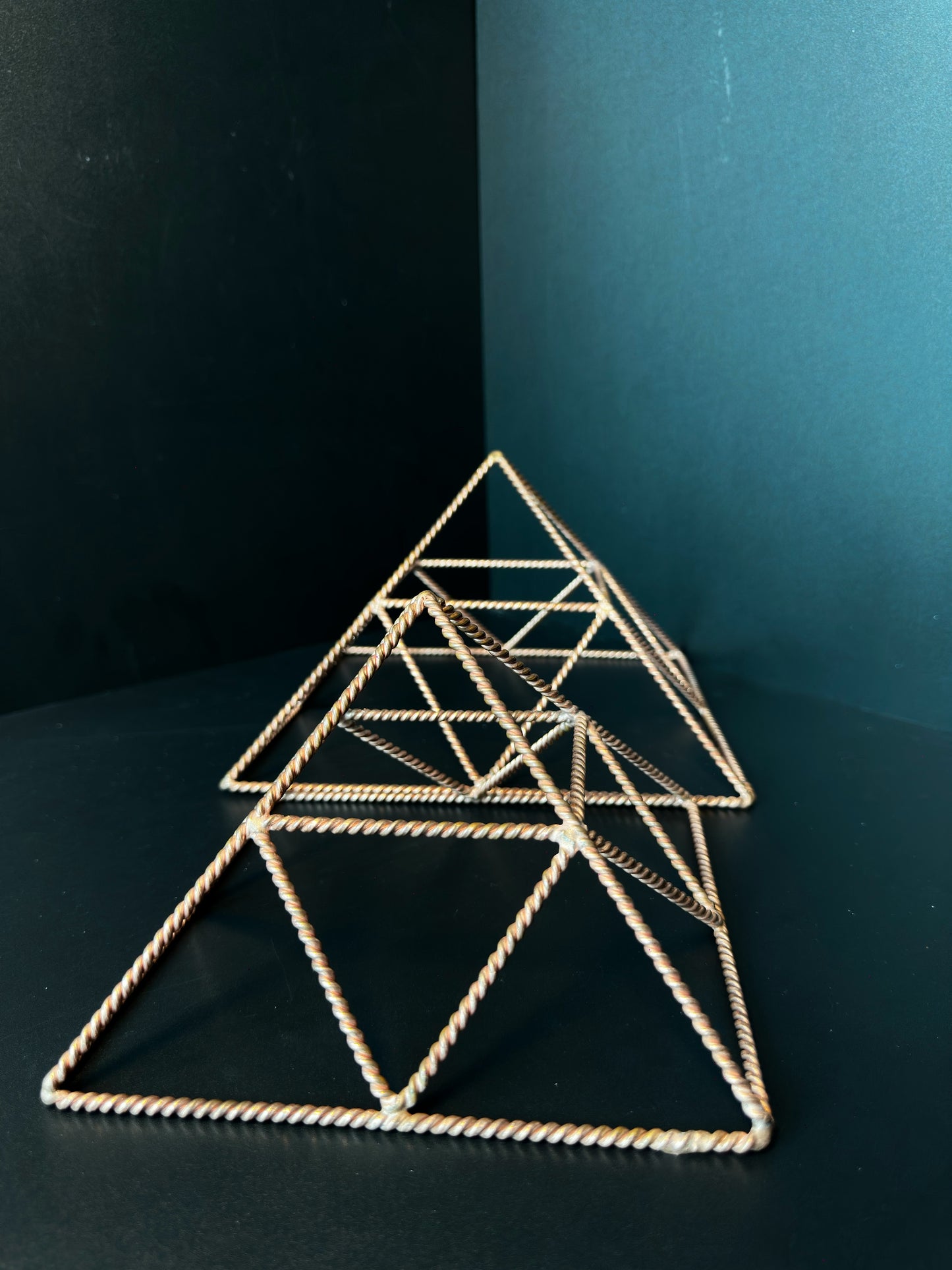 Two reinforced copper pyramids top view, sacred geometry crystal charging set