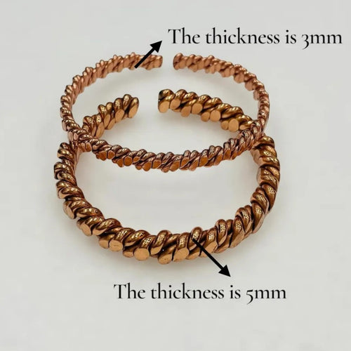 Side view showing the 14 cm height and hand-joined copper ring structure of the water charger
