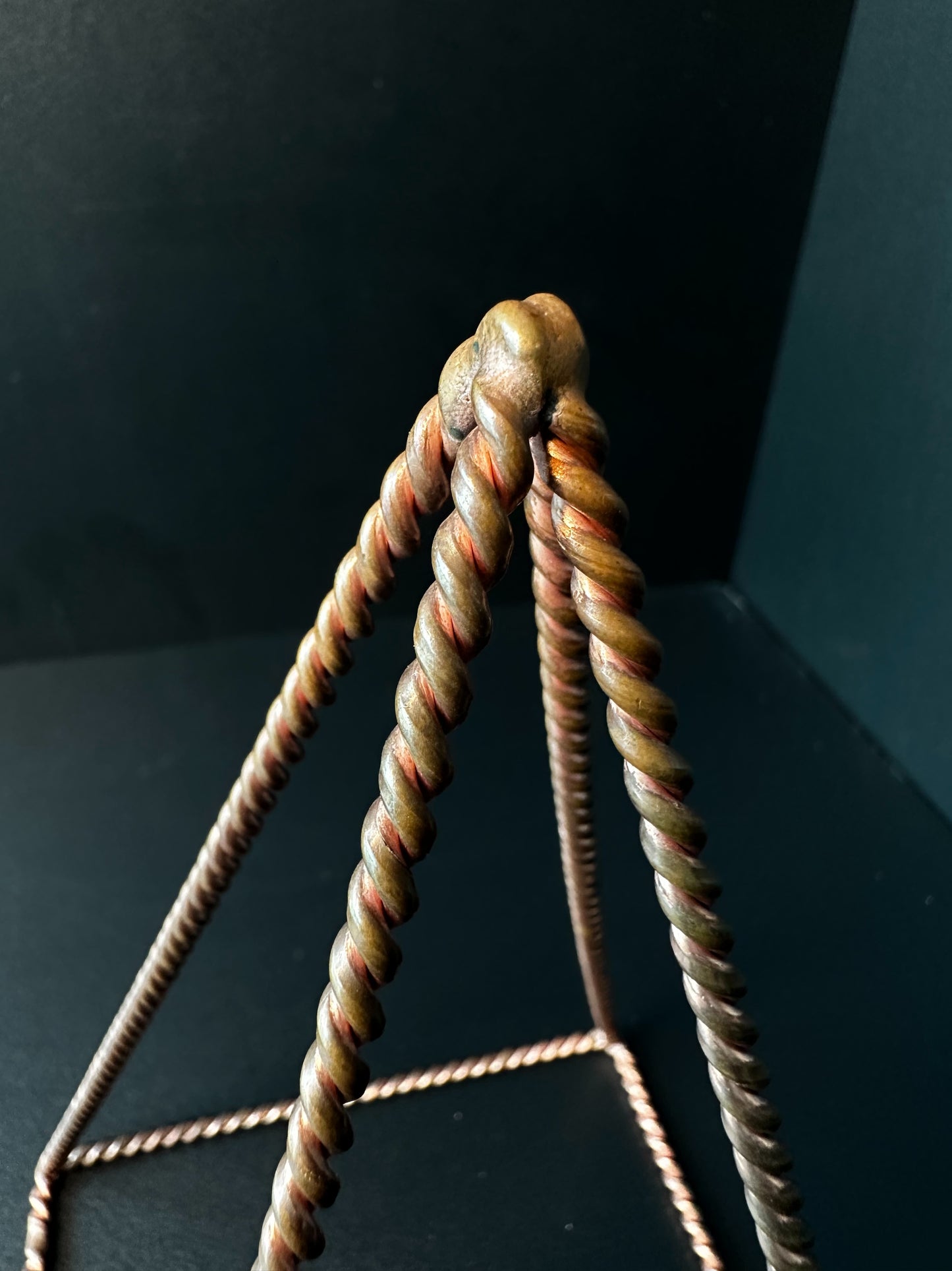 Twisted copper meditation pyramid top view, handmade reiki energy healing tool Vietnam
