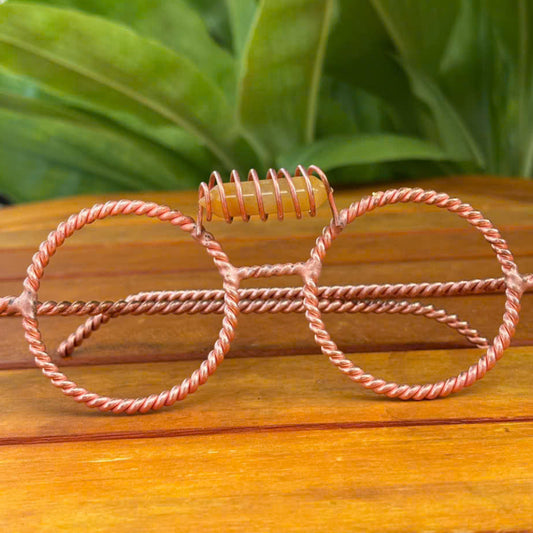 Close up yellow aventurine crystal coil detail on copper tensor glasses